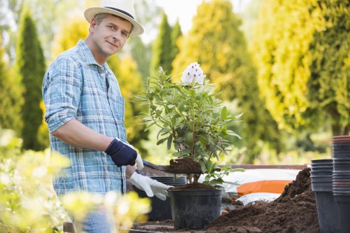 Operatives assessing a residential garden before work begins