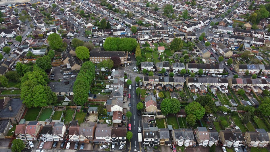 An aerial view of a residential neighborhood in Thornton Heath showing a variety of garden layouts and landscaping styles. Prominent in the image are several well-maintained gardens with neatly trimme